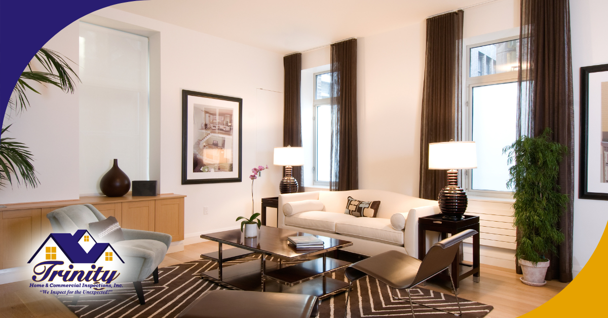 Stylish modern living room with neutral tones, large windows, and accent lighting.