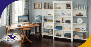 Elegant home office with bookshelves, a wooden desk, and decorative items.