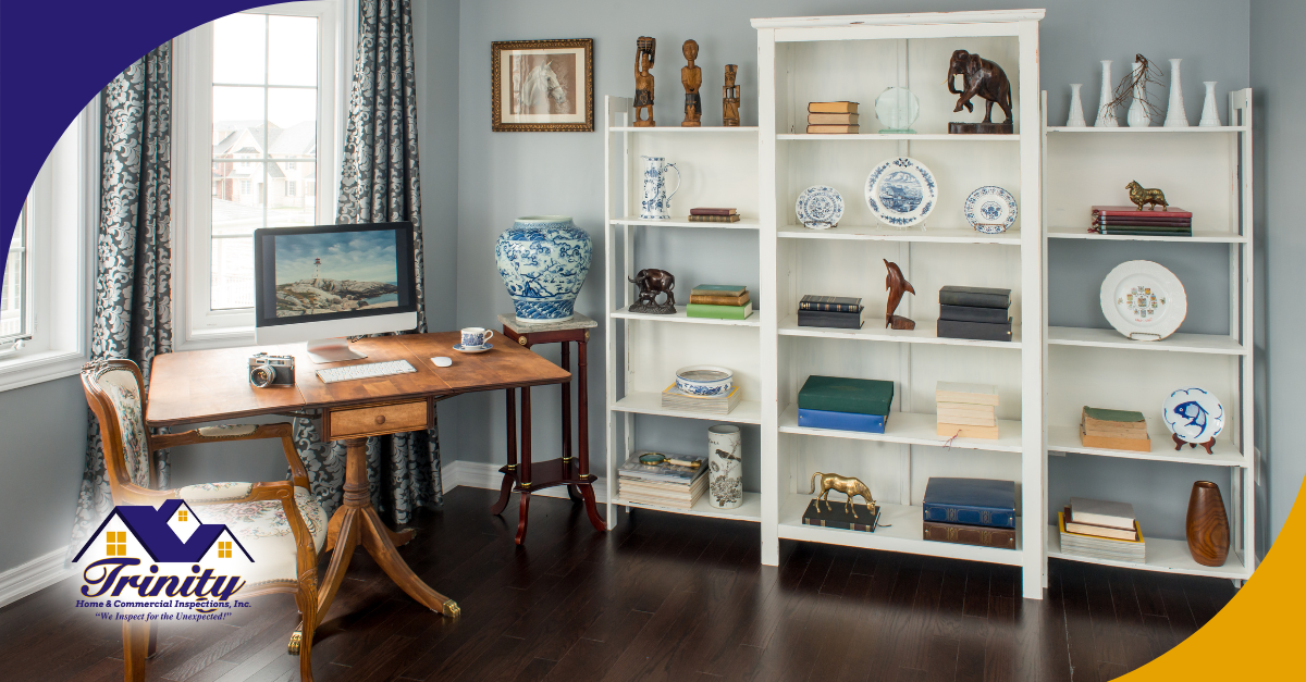 Elegant home office with bookshelves, a wooden desk, and decorative items.