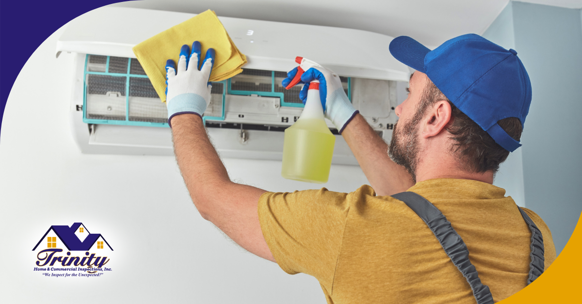 Technician cleaning mini split air conditioner